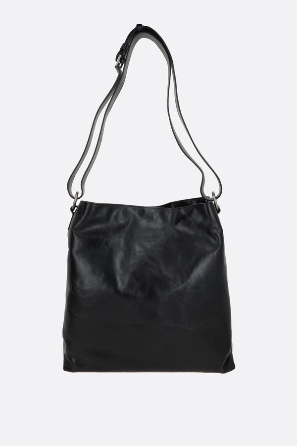 shiny leather messenger bag