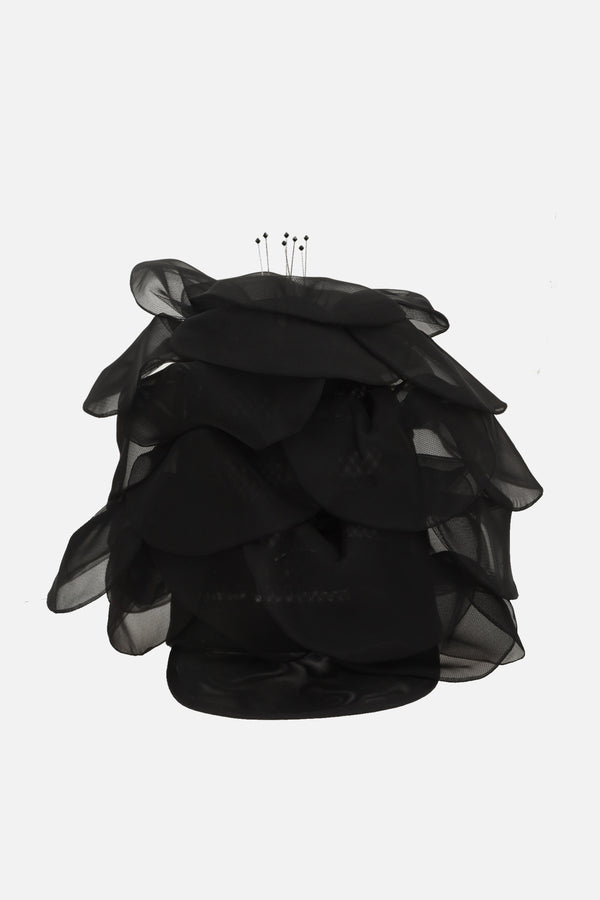 a petal cap in crin, organza, tulle, and rhinestones